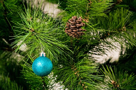 christmas decorations hanging on christmas tree