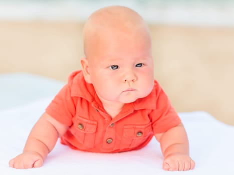 Cute baby laying on the sunbed at the beach