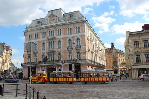 lively street with promenade tramway in the central part of Lvov
