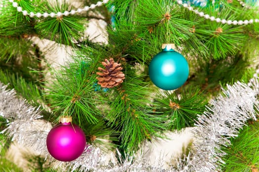 christmas decorations hanging on christmas tree