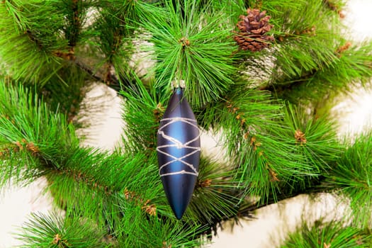 christmas decorations hanging on christmas tree