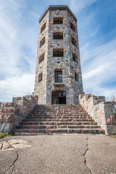 Front entrace of a stone tower during autumn time