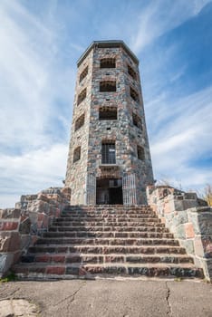 Front entrace of a stone tower during autumn time