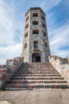 Front entrace of a stone tower during autumn time