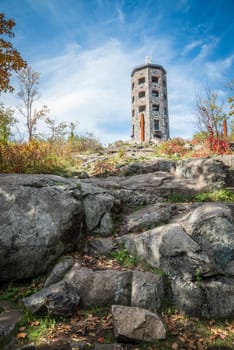 Stone tower in a public park during fall time
