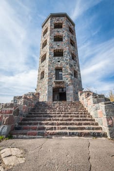 Front entrace of a stone tower during autumn time