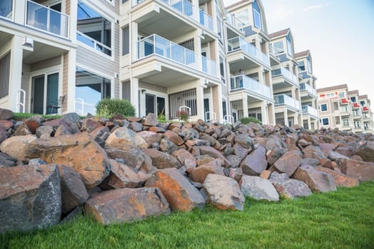 Rock piles in front of a building of luxury appartments
