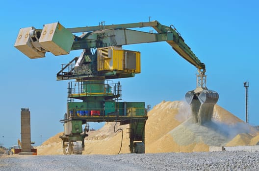 Heavy excavator loader at soil moving works at construction