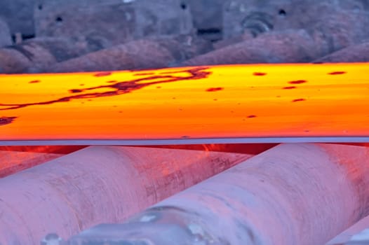 hot steel on conveyor, macro