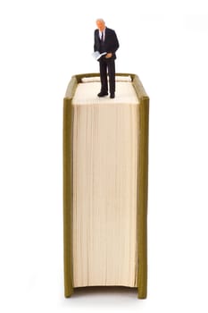 Reader with book on a light background