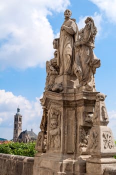 Jesuit priest statue and St. James' Church, in Kutna Hora, Czech Republic.