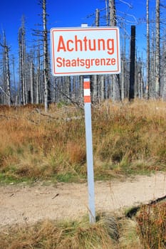 Sign "Staatsgreneze"" at the border triangle Austria,Czech Republic,Germany,Bavarian Forest,Sumava National Park"