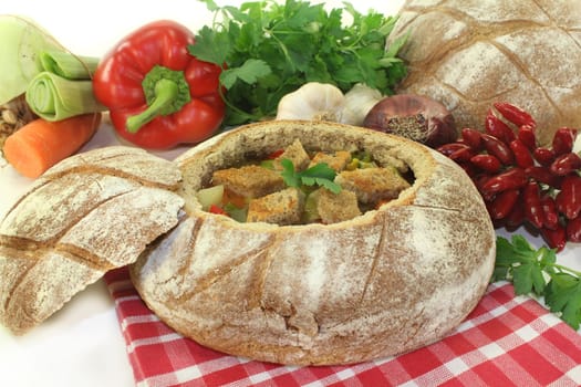a farmer's bread filled with a colorful bread soup