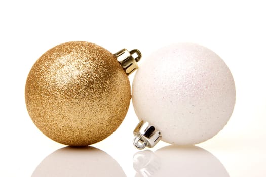 Christmas,golden and white baubles insulated with white background