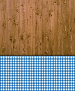 Wooden background with blue and white tablecloth pattern