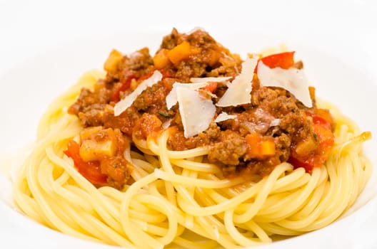 Close-up of spaghetti Bolognese with Parmesan cheese