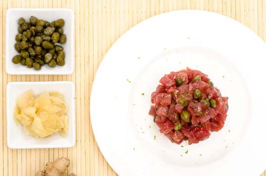 Tuna tartare with capers and zests of a lime