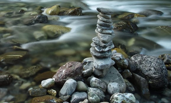 A pile of stones by a river