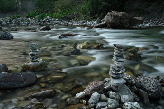Stone men on a large river