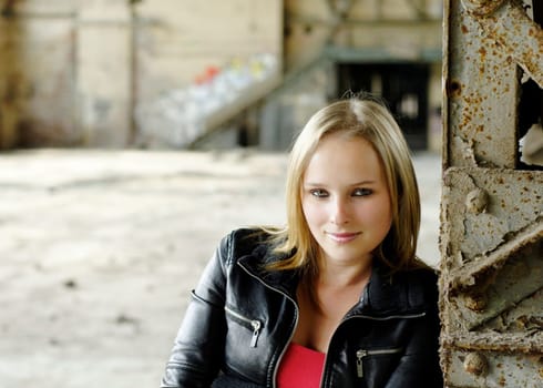 Young woman looks bashfully into the camera