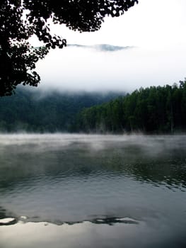 Lake with early morning fog