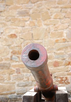 Medieval cannon by city walls