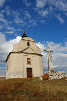 Chapel with cross on hill