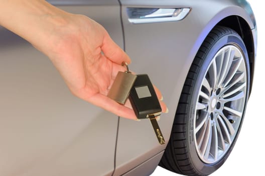 Elegant woman's hand holding prestigious car keys isolated