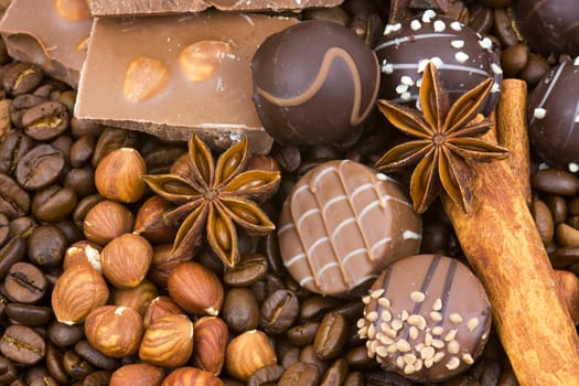background with chocolate, coffee, spices and nuts