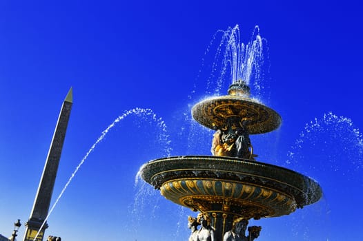 Fountain on Place de la Concorde in Paris with visible Luxor Obelisk