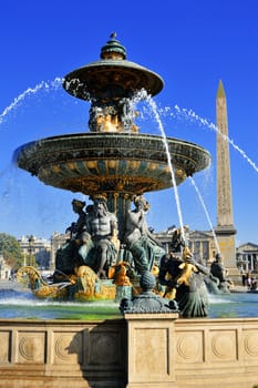 Fountain on Place de la Concorde in Paris with visible Luxor Obelisk
