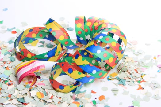 Streamers and confetti as party decoration for birthday with white background