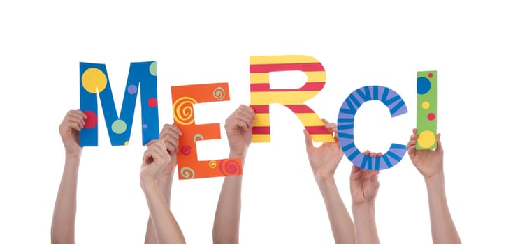 Many Hands Holding the Colorful French Word Merci, Which Means Thanks, Isolated