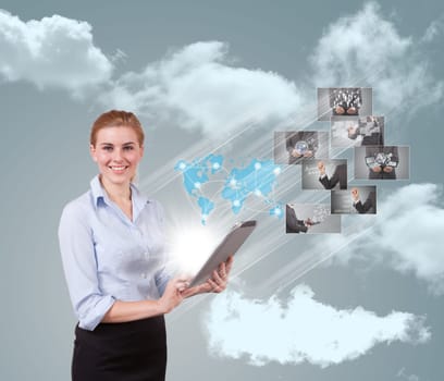 Portrait of businesswoman holding her tablet computer and communicating with her team across the world.