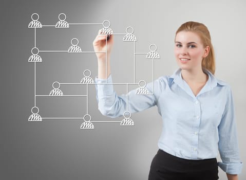 businesswoman drawing social network structure on glass
