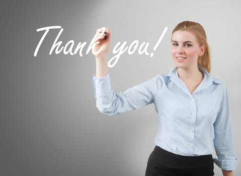businesswoman write 'thank you' on glass
