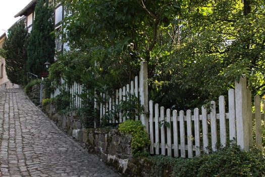 Alley with garden fence in Bösingfeld