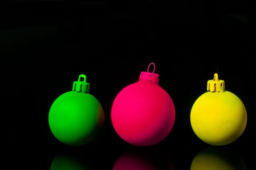 Christmas bauble cropped,on black background,neon green,neon pink,neon yellow