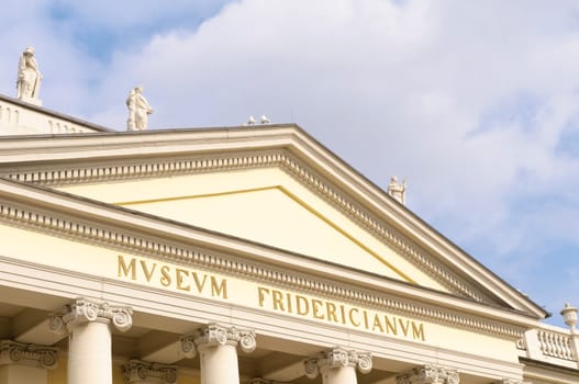 The Fridericianum is a museum building in Kassel,Germany. Completed in 1779,the building served from the outset as one of the first public museums on the European continent for the art objects collected by the Hessian landgraves and housed the princely library. In the Kingdom of Westphalia,the Fridericianum was from 1810 to 1813 Estates Palace with Parliament Hall. Today,the Fridericianum becomes the center of documenta every five years and is an exhibition venue for contemporary art,the "Kunsthalle Fridericianum""... The building is located on Friedrichsplatz between the former old town and the Oberneustadt."