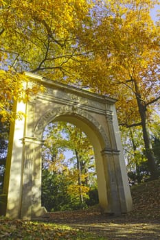 Close up view of unknown romantic gate at autumn park.