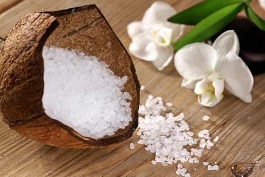 Coconut with bath salts and orchids