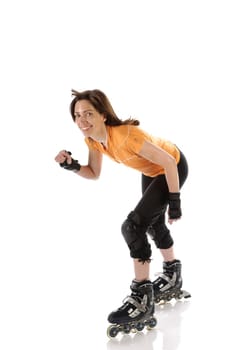 Adult woman has fun with inline skating in front of a white background