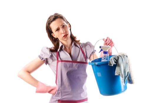 Housewife,cleaning lady with long dark blond hair and kitchen apron doing housework against a white background.