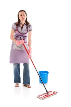Housewife,cleaning lady with long dark blond hair and kitchen apron doing housework against a white background.
