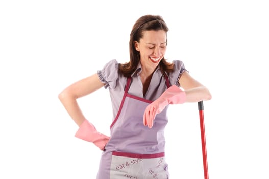 Housewife,cleaning lady with long dark blond hair and kitchen apron doing housework against a white background.