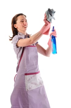 Housewife,cleaning lady with long dark blond hair and kitchen apron doing housework against a white background.