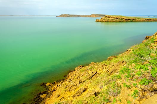 Barren islands in a green sea in La Guajira, Colombia