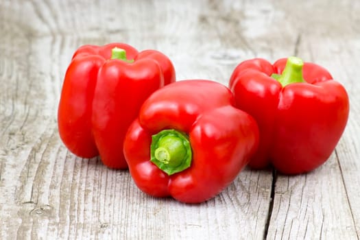 red peppers on wooden background