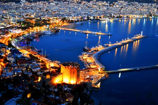 View of Alanya harbor form Alanya peninsula. Turkish Riviera by night