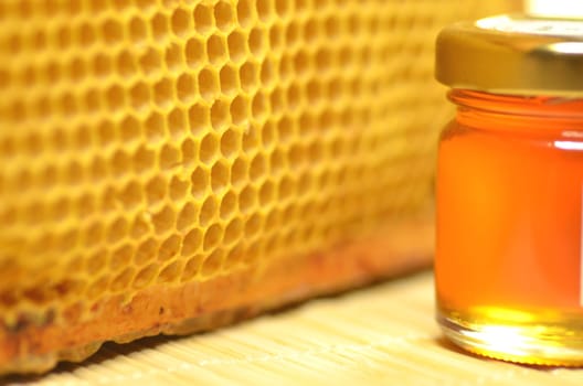 jar full of fresh delicious honey with natural honeycomb